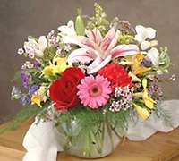 Arreglo floral premium con gerberas, rosas y lilium