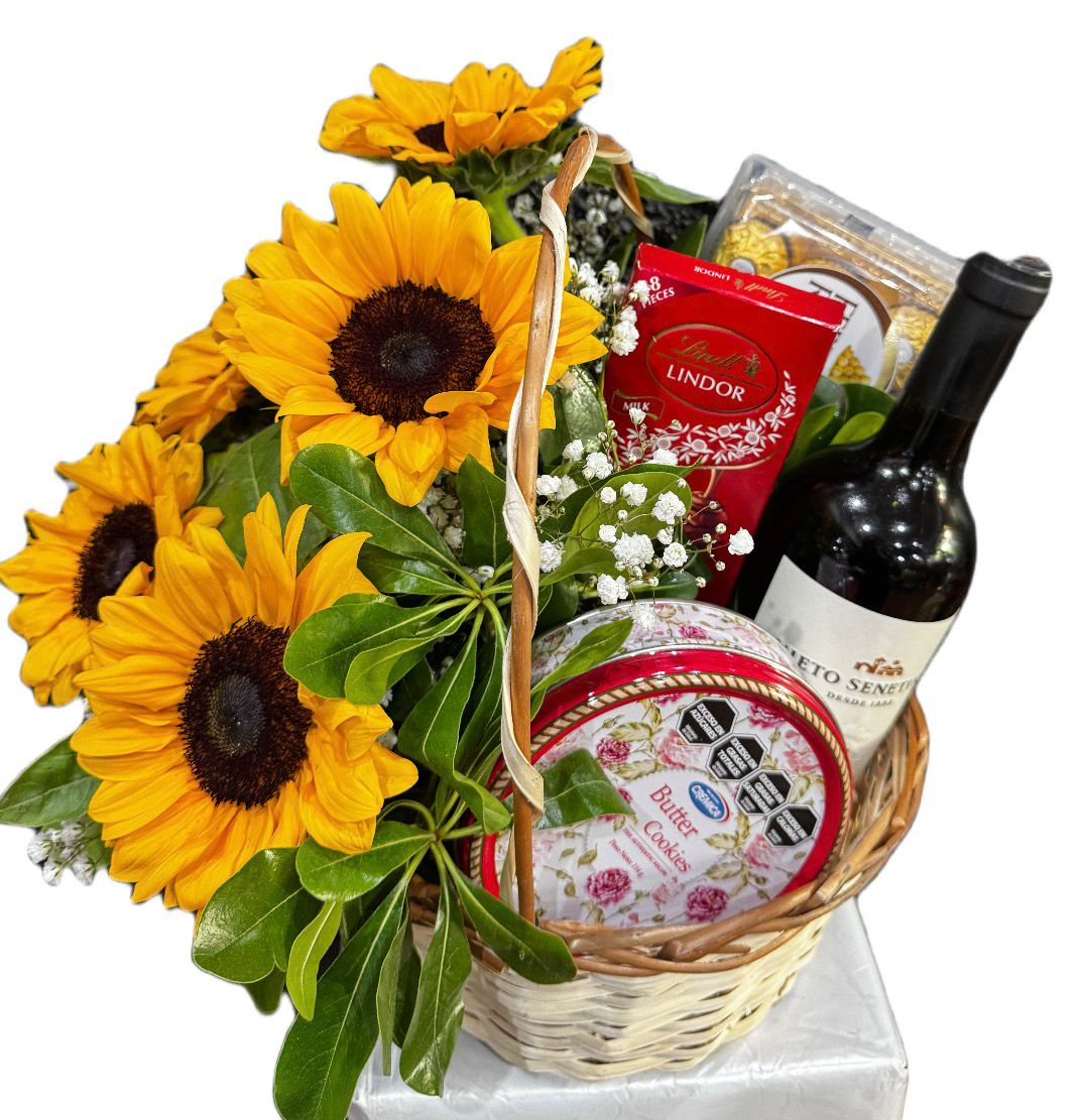 Foto de 	Canasta Girasoles vino Tinto chocolates y galletitas importadas